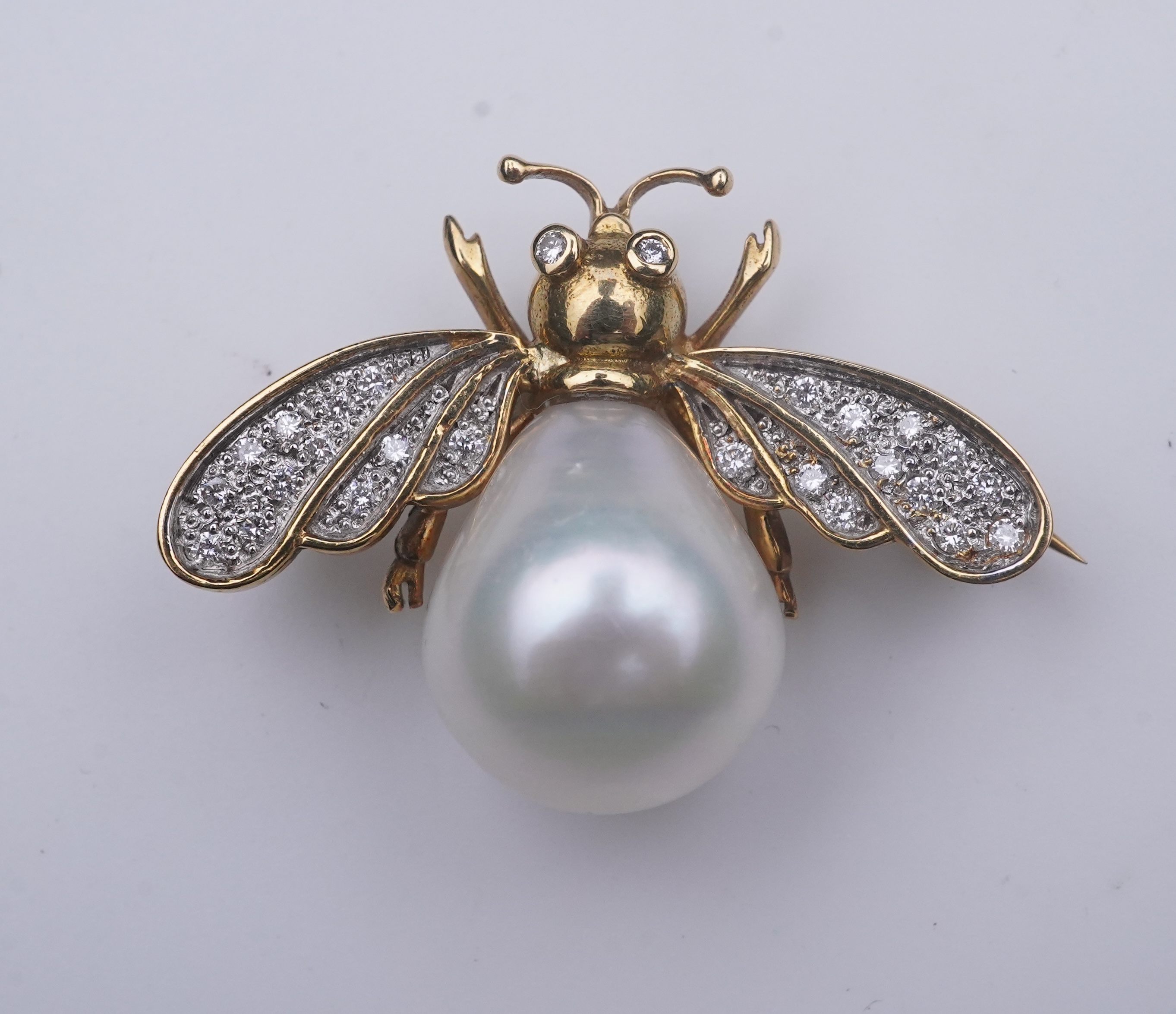 Deakin & Francis, a pair of 18ct gold, cultured pearl and diamond brooches